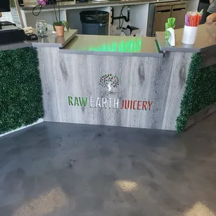 a counter with a sign on it