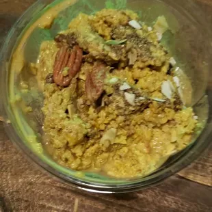 a bowl of food on a wooden table