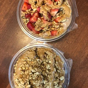 two bowls of oatmeal and strawberries