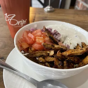 Chicken bowl with rice, veggies, chicken, and a yummy sauce