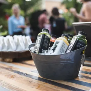 a variety of beverages in buckets