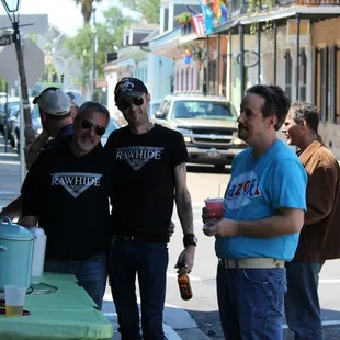 a group of men walking down a street