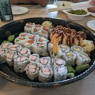 Kani Roll, Philadelphia Roll, Shrimp Tempura Roll, Spicy Salmon Roll, and Snowman Roll