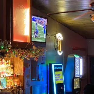 a television and neon signs