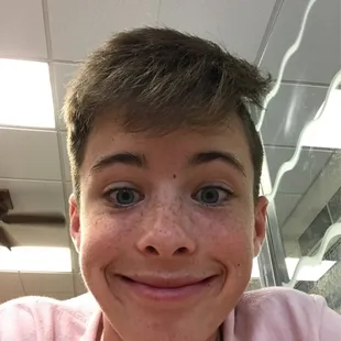 a boy with freckles on his face