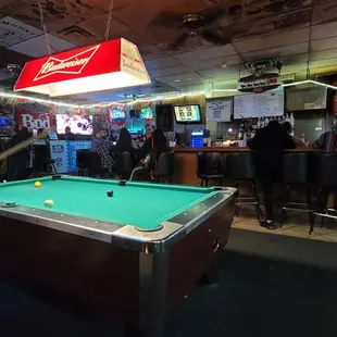 a pool table in a bar