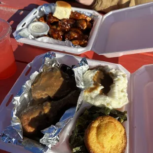 Smothered chicken, mashed potatoes, greens, jalapeño cornbread, and bbq wings. Everything came with koolaid!