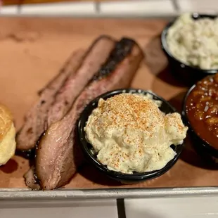 Brisket, potato salad, baked beans, slaw, and roll