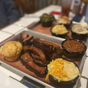 Brisket, ribs, mac and cheese, baked beans, jalapeño cheese grits, popover, banana pudding, peach cobbler