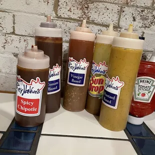 Sauces on table. More if you ask like Texas Pete.