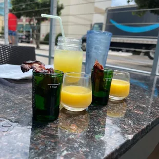 Breakfast shots! Bite some bacon, take the shot, chase with OJ and finish off with bacon!
