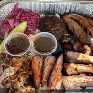 ribs, coleslaw, pickles, pickles, and pickle