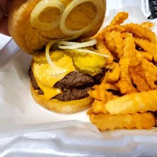 Large Cheeseburger (Mustard, Pickle, and Onions) with Seasoned Fry's ...... Look at that meat!