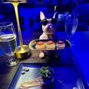 a plate of food and a glass of wine