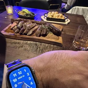 a man's hand with a watch on his wrist
