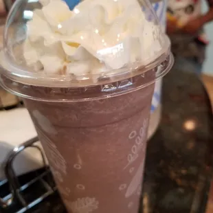 a chocolate milkshake with whipped cream