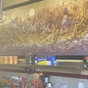 Vietnamese mural on right side.
