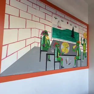 a mural of a pizza parlor