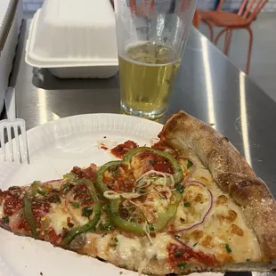 A slice of Little Bunny Rabbit pizza and Russian River Pilsener beer.