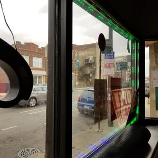 a view of a street through a window