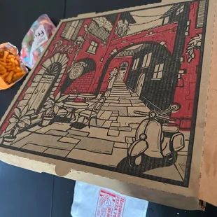 a pizza box with a drawing on it