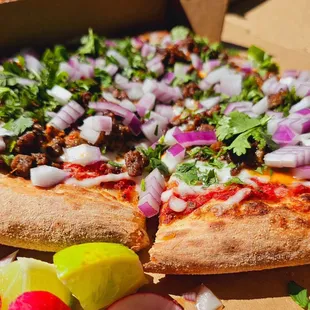 Carne asada pizza by the slice