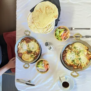 Sausage egg and Shakshuka egg with side salads, flat bread and Turkish coffee