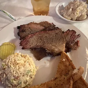 Biscuit platter with corn bread salad and macaroni and sweet tea