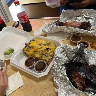 Loaded brisket potato, turkey legs, Brisket Sandwich
