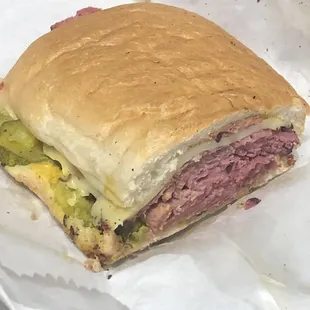Pastrami &amp; provolone with pickles pressed (I cut it to show you how much meat you get with the sandwich).