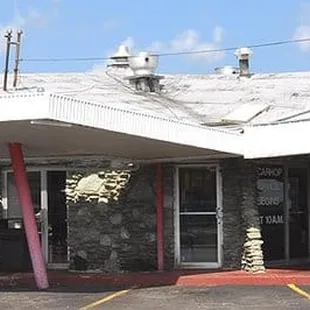 a car parked in front of a restaurant