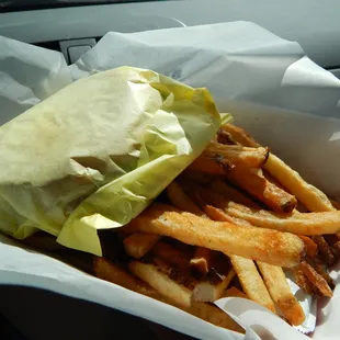 Small fries with a burger in its wrapper.