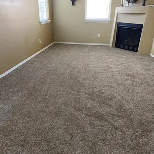 a fireplace and two windows