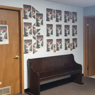 a wooden bench in a hallway