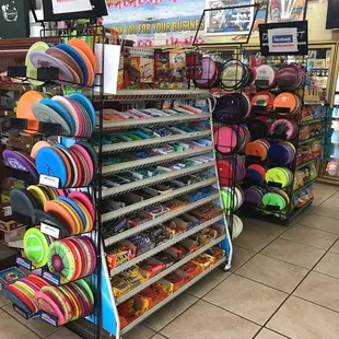 3 racks of Disc golf accessories
