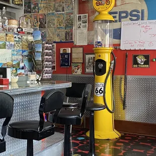 a yellow gas pump in a diner