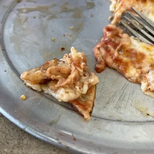 a half eaten slice of pizza