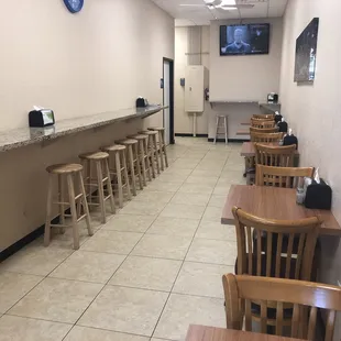 a row of wooden chairs in a restaurant