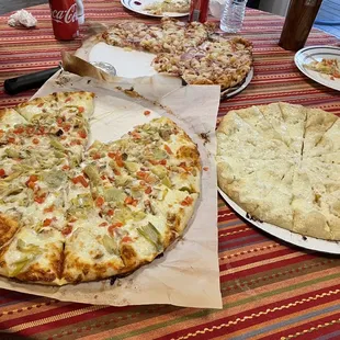 Chicken and artichoke pizza, cheesy garlic bread, bbq chicken pizza