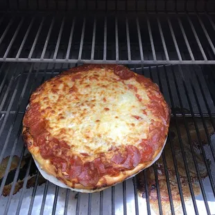 Cooked pepperoni pizza with extra cheese