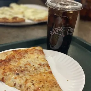 a slice of pizza on a paper plate