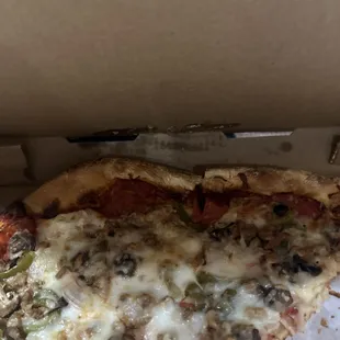 Veggie pizza, that didn&apos;t fit in the pizza box. So they just crammed it in and it folded over on its self