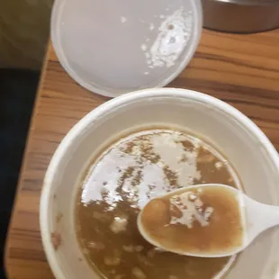 a bowl of soup with a spoon in it