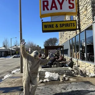 a polar bear holding up a sign