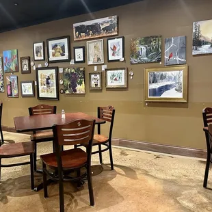 Dining area with artwork for sale