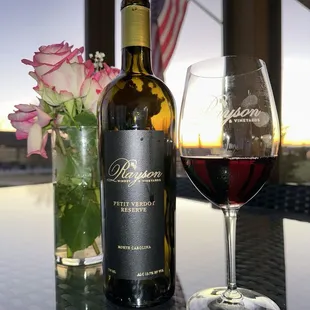 a glass of wine and a bottle of wine