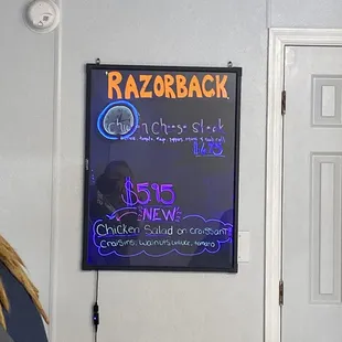 a woman standing in front of a sign