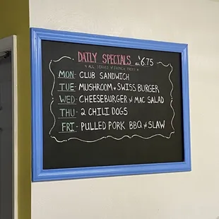 a menu on a chalkboard in a restaurant