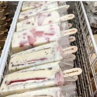 Two of our very own and delicious Paletas  Gansito and Fresas con Crema