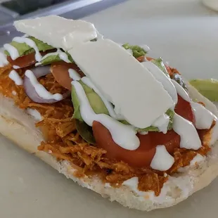 Mexican Chicken Tinga Sandwich crafted with juicy pulled chicken, slow-cooked in a rich spicy chipotle sauce. It is a flavorful experience